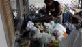 Fire victims sort through donated clothing. (Photo 9 of 10 photo(s)).