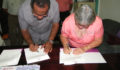  Dr. Gary Fraser, President of UB and Mrs. Martha Guerrero, Chairlady for the SPJC sign MOU (Photo 5 of 8 photo(s)).