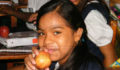 Apples and other treats are given out to the students at each school (Photo 6 of 10 photo(s)).