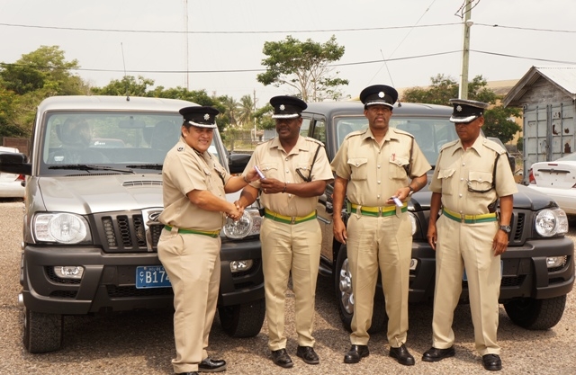 Deputy Compol Aragon hands over vehicles to OC  Northern Zone Joseph Myvette - accompanied by OC Orange Walk Dennis Arnold and- (1)