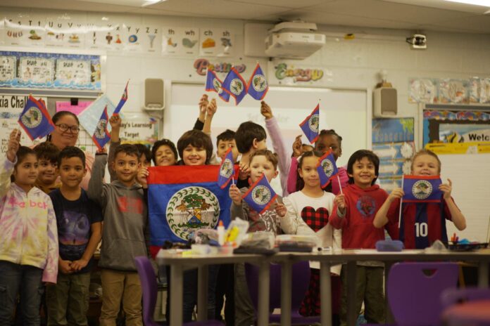 10-Participate Learning-Belizean teacher with American students